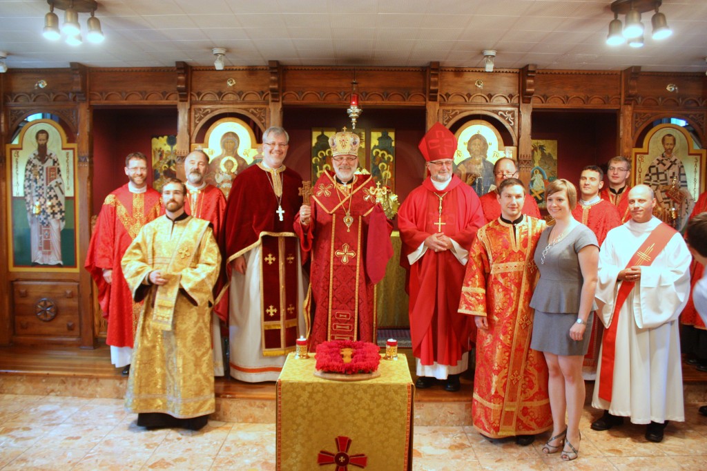 Deacon Gleb Pistruga and his wife Joanna Olender with the clergy at his ordination to the diaconate.